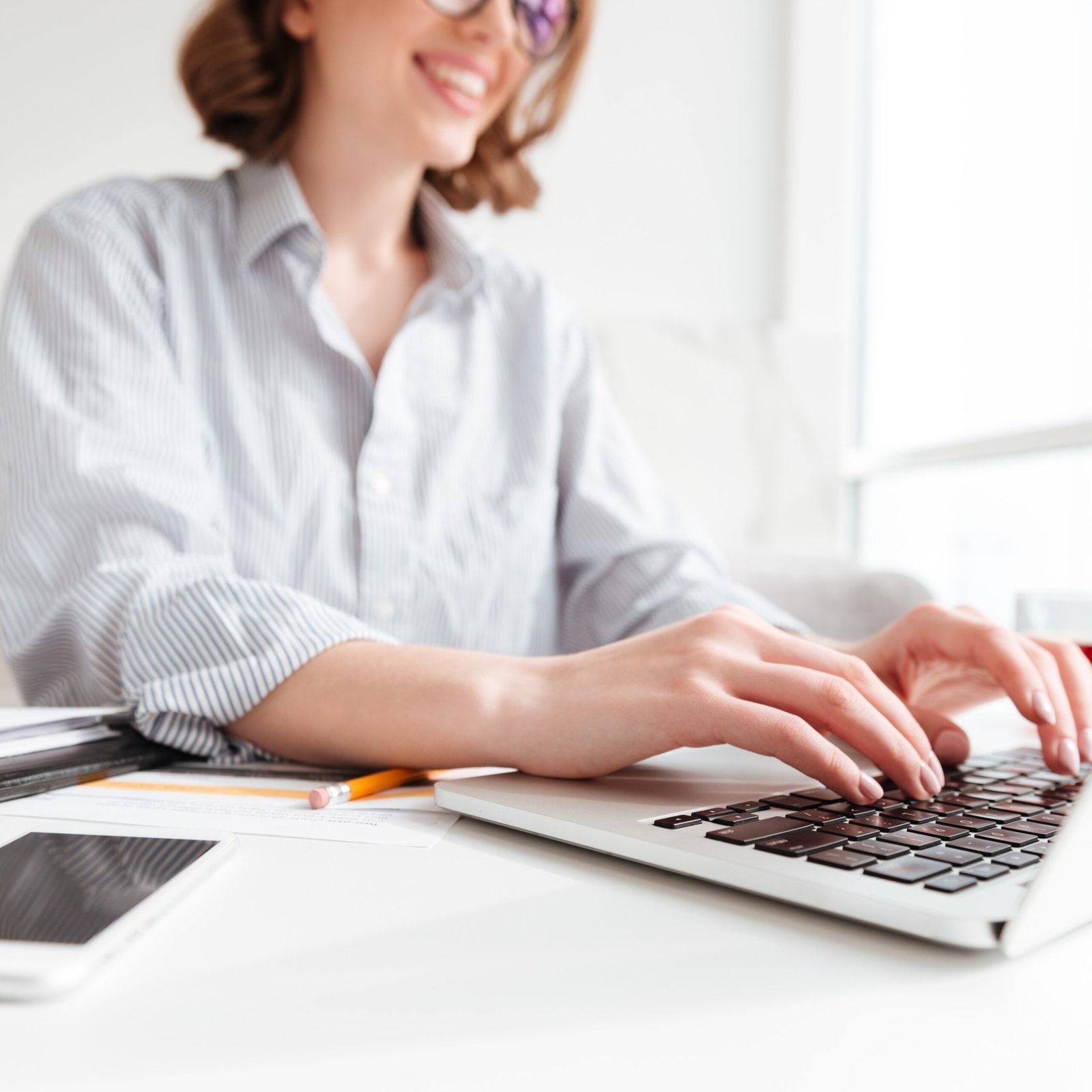 brunette woman typing email laptop computer while sitting home selective focus hand